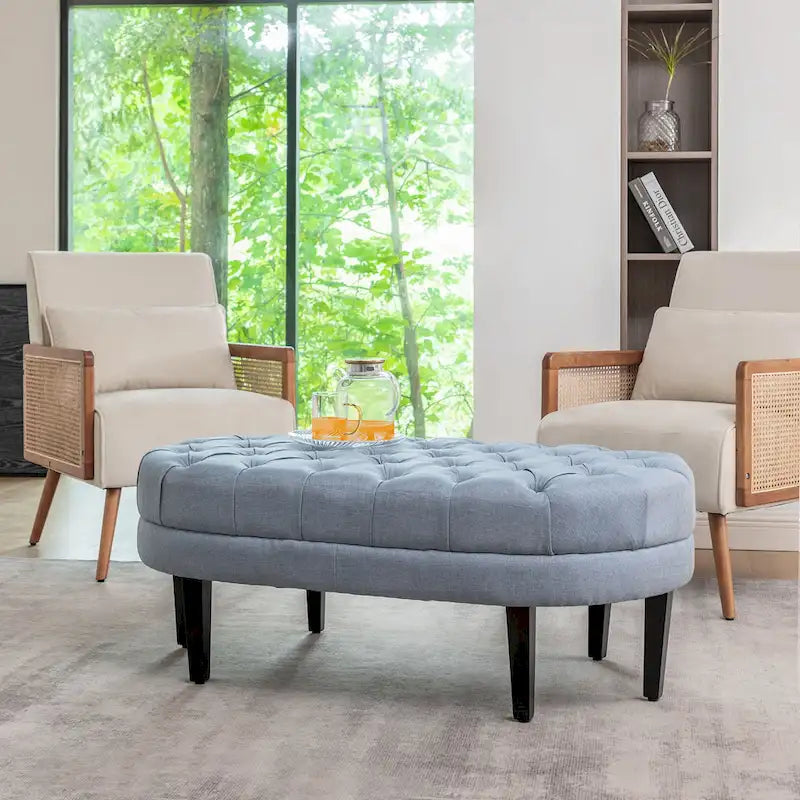 Pouf de cocktail ovale en tissu Itan avec pieds en bois d'hévéa