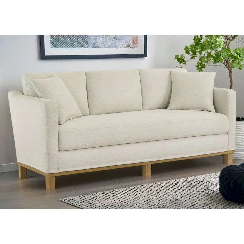 Canapé 3 places rembourré Jolene avec piètement en bois et coussins décoratifs
